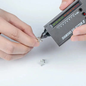 Diamond tester device verifying authenticity of a lab grown diamond in 14K gold plated jewelry