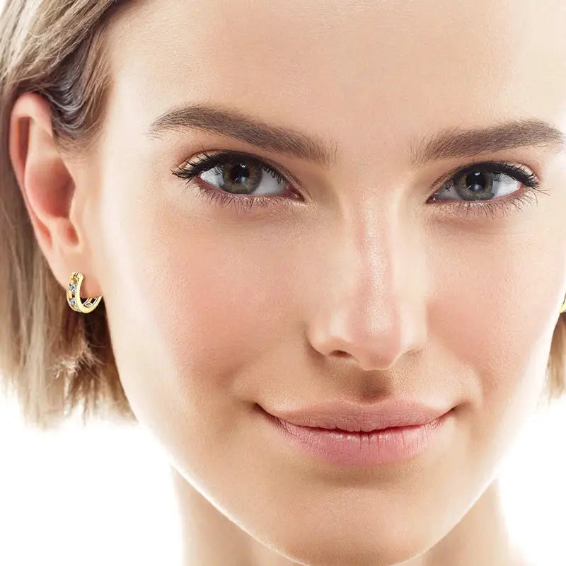 Close-up portrait of a woman wearing 18K Gold Plated Hoop Earrings with Lab Grown Diamonds