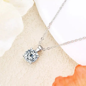 Silver necklace featuring a sparkling diamond pendant from an 18k gold plated diamond jewelry set