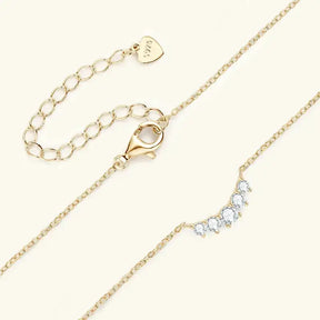 Delicate gold plated moissanite necklace featuring diamond-like stones in elegant design