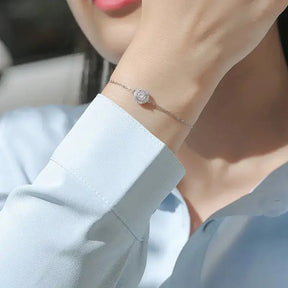 Delicate silver 5mm Moissanite Diamond bracelet with charm, embodying elegance and sophistication