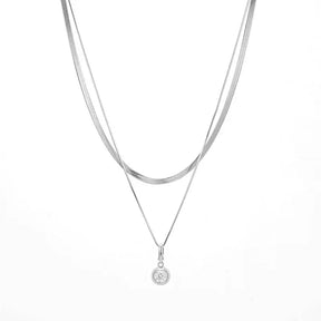 Layered S925 sterling silver necklace featuring a round pendant and 1ct moissanite diamond