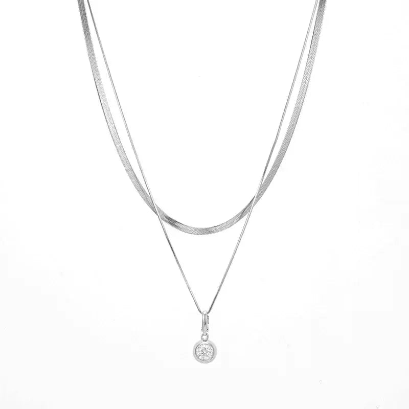 Layered S925 sterling silver necklace featuring a round pendant and 1ct moissanite diamond