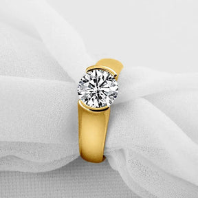 Gold ring featuring a round diamond solitaire in a 2-carat Moissanite Ring design