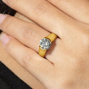 Gold ring featuring a round diamond solitaire in the 2-carat Moissanite Ring design