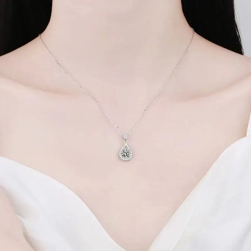 Teardrop-shaped 2ct Moissanite Diamond pendant on delicate silver chain for elegant wedding necklace