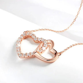 Rose gold double heart moissanite necklace with diamond accents for elegant style