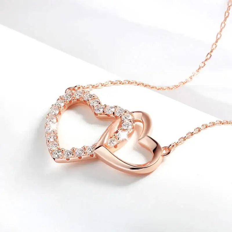 Rose gold double heart moissanite necklace with diamond accents for elegant style