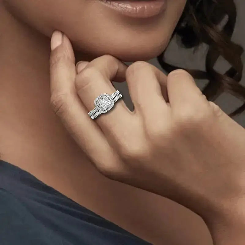 Diamond engagement ring on woman’s hand showcasing Moissanite ring set in luxury design