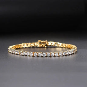 Gold diamond tennis bracelet featuring a continuous line of lab grown diamonds