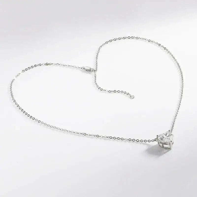 Silver necklace featuring a cube-shaped pendant with 4cttw Heart Cut Moissanite design