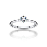 Solitaire diamond engagement ring featuring a 4mm Moissanite silver band and elegant 18k gold