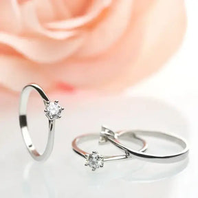 Diamond engagement rings featuring delicate silver bands and a 4mm Moissanite Silver design