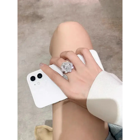 Diamond engagement ring on hand with smartphone showcasing 5CT Moissanite Ring Big Diamond Elegance