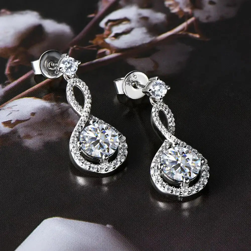 Elegant diamond drop earrings showcasing teardrop design with lab grown diamond allure