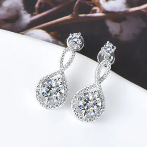 Elegant diamond drop earrings featuring lab grown diamonds and intricate silver settings