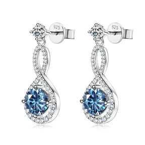 Elegant silver dangle earrings with blue gemstones and infinity design, featuring lab grown diamonds