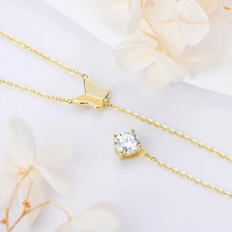 Delicate gold necklace featuring a Lab Grown Diamond butterfly pendant and charm