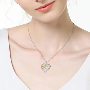 Heart pendant necklace in gold and silver with a 5mm moissanite heart gemstone