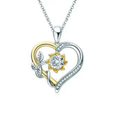 Heart pendant necklace with silver and gold design featuring a diamond accent and 5mm moissanite heart