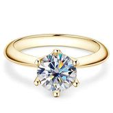 Gold solitaire 8MM 2CT Moissanite Ring with a round brilliant diamond from Telles Jewelry