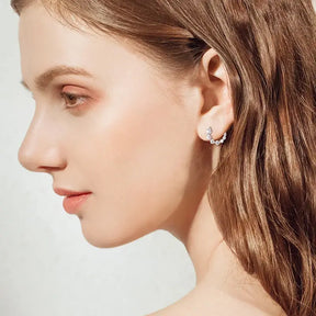 Profile view of a woman showcasing 925 Silver C-Shape Tapering Earrings with Lab Grown Diamonds