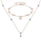 Rose gold jewelry set with star pendants and anchor charm in sterling silver clover design