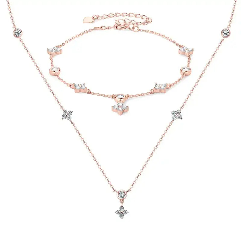 Rose gold jewelry set with star pendants and anchor charm in sterling silver clover design