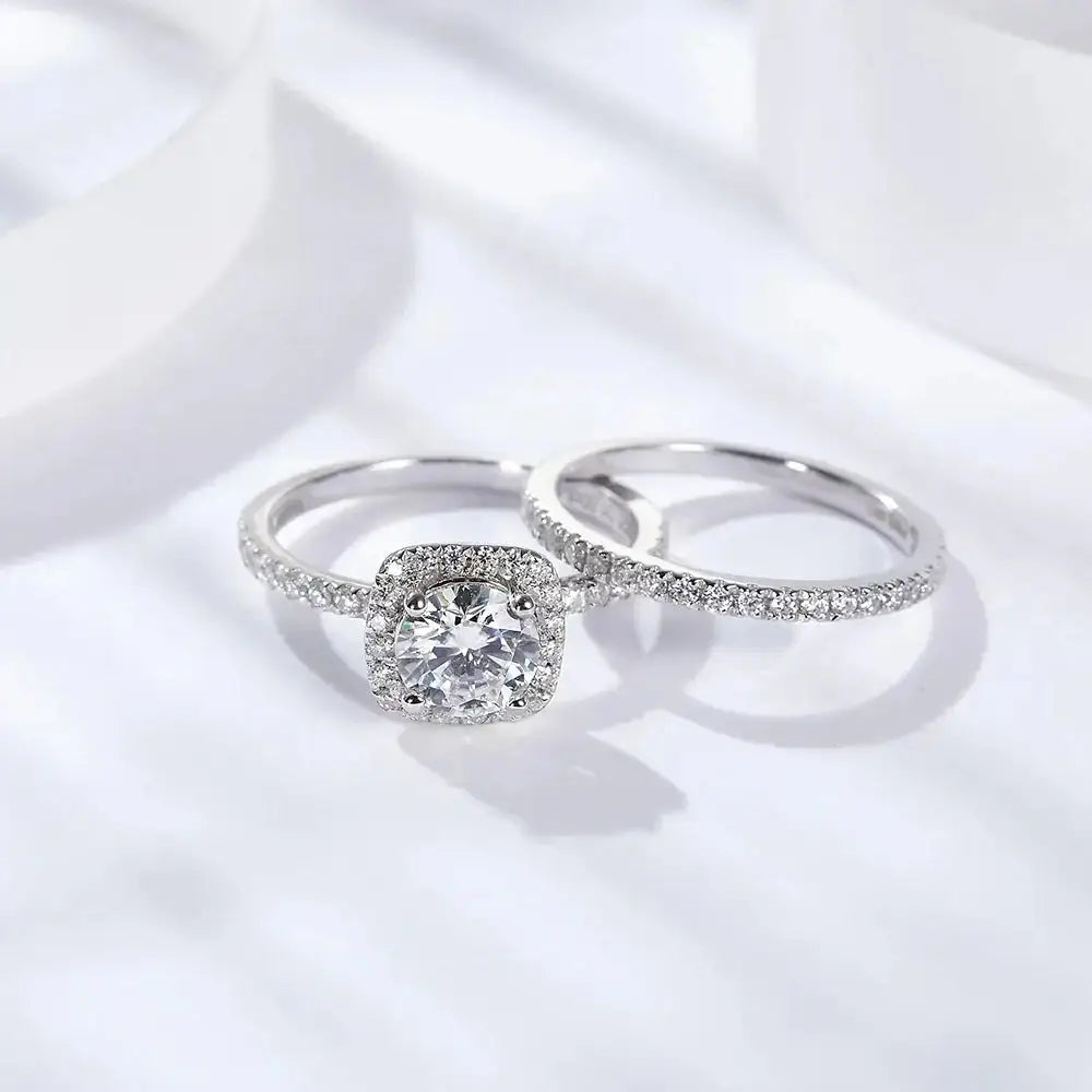 Cushion-cut Moissanite diamond ring set in sterling silver with a pave band for elegance