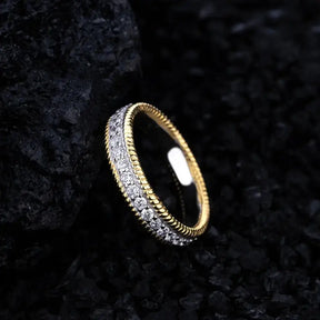 Gold ring featuring silver created Moissanite diamonds in a stunning wedding band design