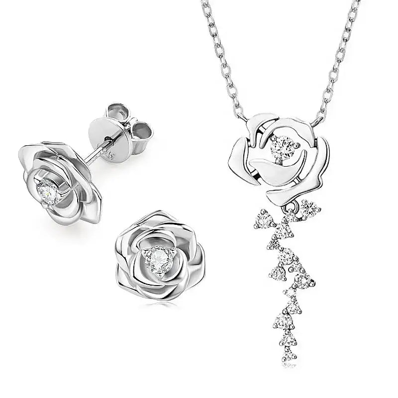 Silver jewelry set featuring rose designs and diamond accents in 925 Sterling Silver