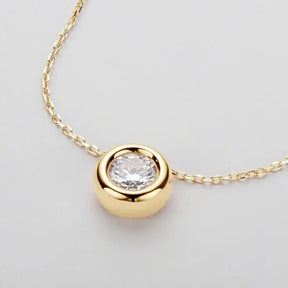 Gold pendant necklace with round cut Moissanite set in 925 Sterling Silver