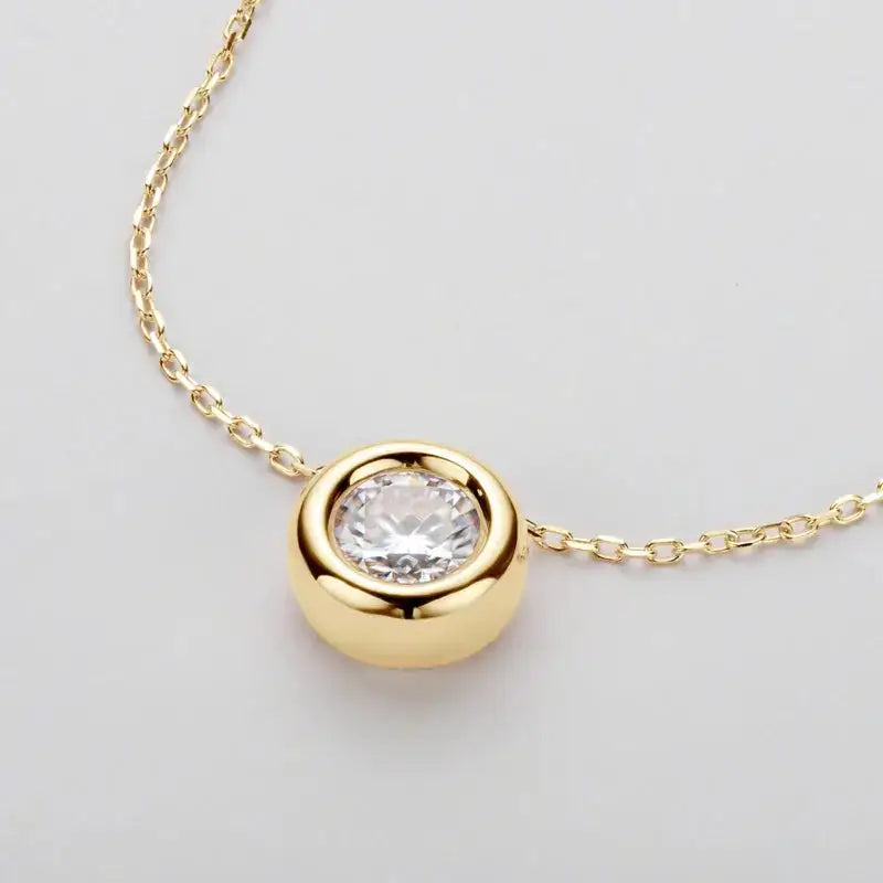 Gold pendant necklace with round cut Moissanite set in 925 Sterling Silver