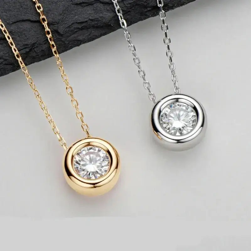 Pendant necklace featuring round cut moissanite in 925 sterling silver setting