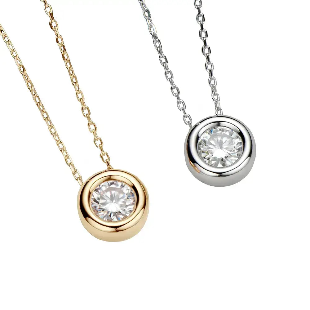 Two pendant necklaces with round cut moissanite in sterling silver and gold settings