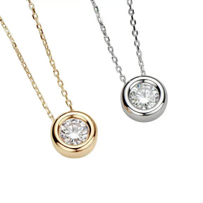 Two pendant necklaces with round cut moissanite in sterling silver and gold settings