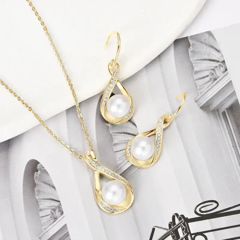 Gold-toned infinity design sterling silver pearl jewelry set with teardrop pendants