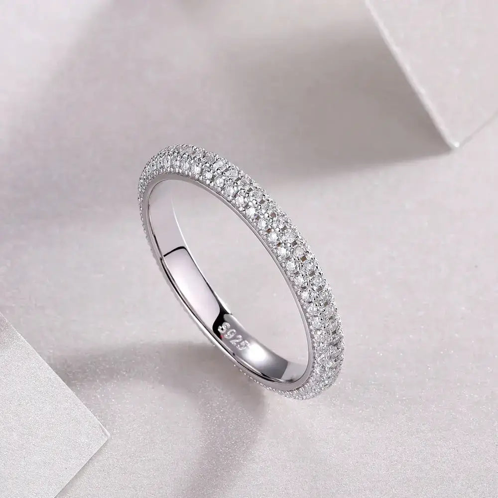 Delicate diamond-encrusted eternity ring in white gold, part of Moissanite diamond rings collection