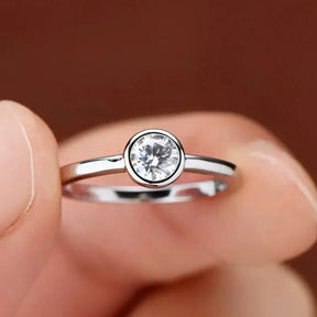 Delicate Bezel Moissanite Ring with round diamond in 925 sterling silver elegance