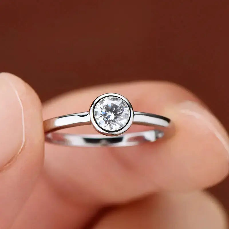 Delicate Bezel Moissanite Ring with round diamond in 925 sterling silver elegance