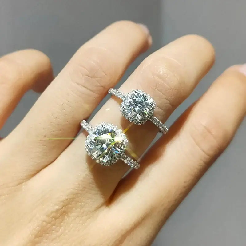 Two diamond engagement rings showcasing a Brilliant Moissanite Halo for women