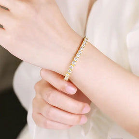 Delicate gold bracelet featuring small lab grown diamonds from the D Color Lab collection