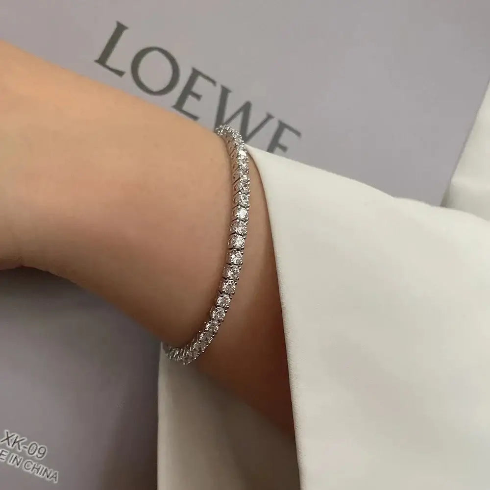 Delicate diamond tennis bracelet featuring lab grown diamonds on a stylish wrist