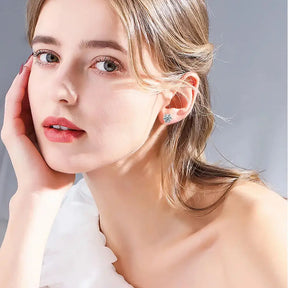 Close-up portrait of a young woman showcasing D Color Moissanite Screw Back Earrings in Sparkling S925 Silver