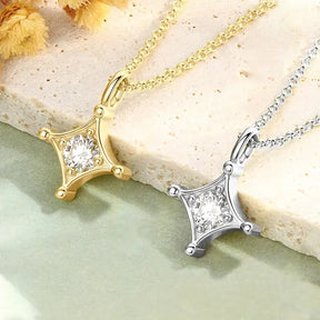 Two star-shaped pendant necklaces in gold and silver, featuring central diamonds in a Moissanite jewelry set