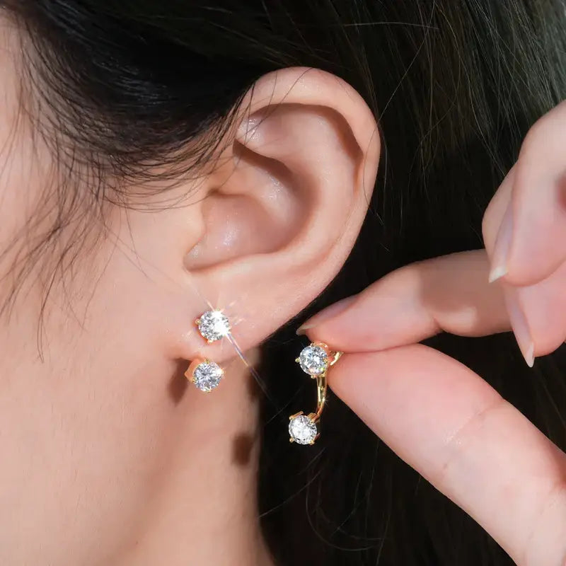 Sparkling 5mm D Color Lab Grown Diamond Drop Earrings being placed in an ear