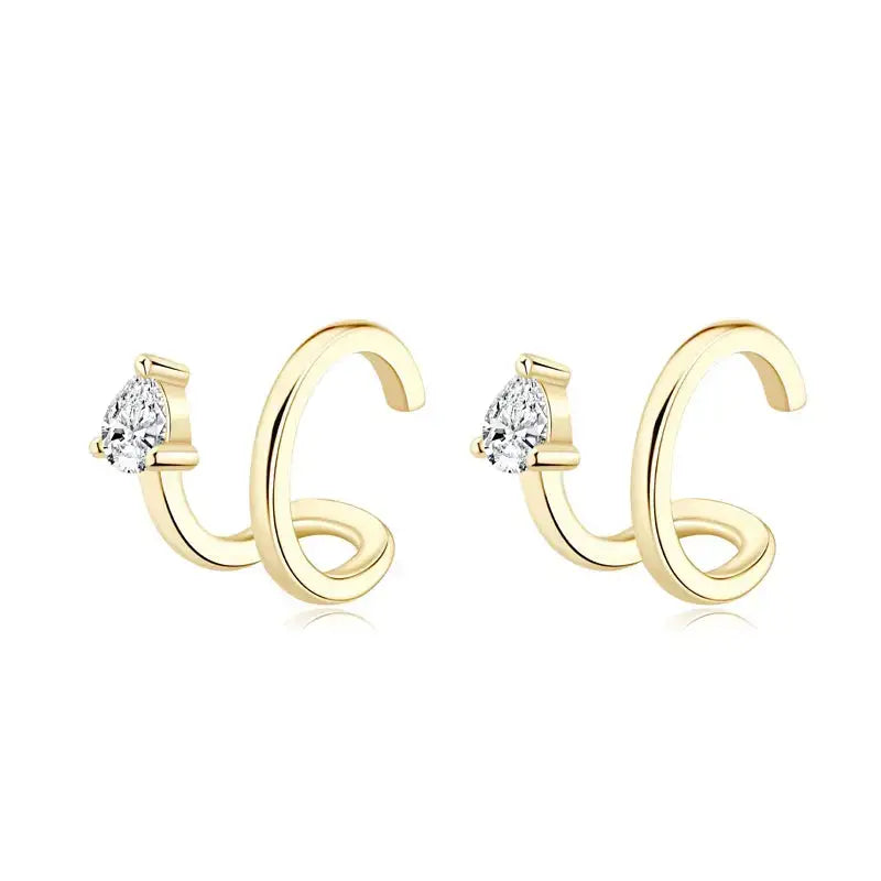 Pair of gold-colored ear cuffs featuring pear cut moissanite diamond accents