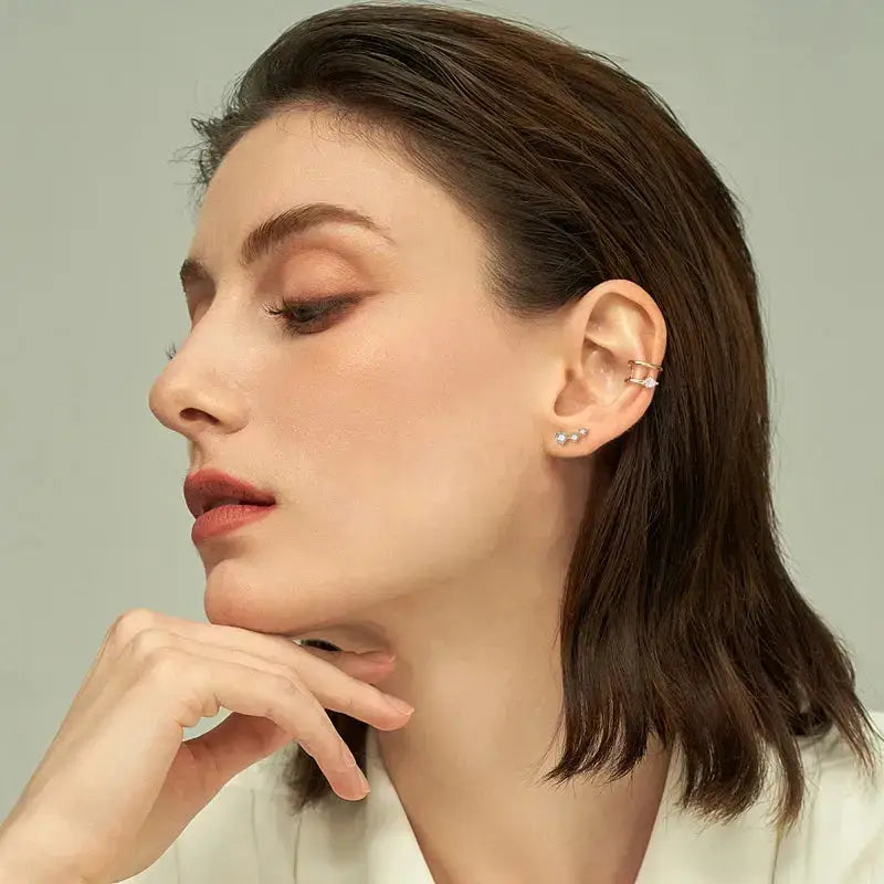 Profile view of a woman showcasing Elegant Ear Cuffs with pear cut moissanite