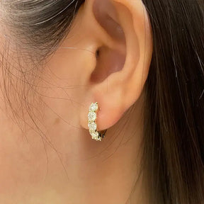 Gold hoop earrings with small diamonds, part of Luxury Lab Grown Diamond Huggie Earrings