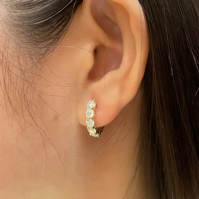 Gold hoop earrings with small diamonds, part of Luxury Lab Grown Diamond Huggie Earrings